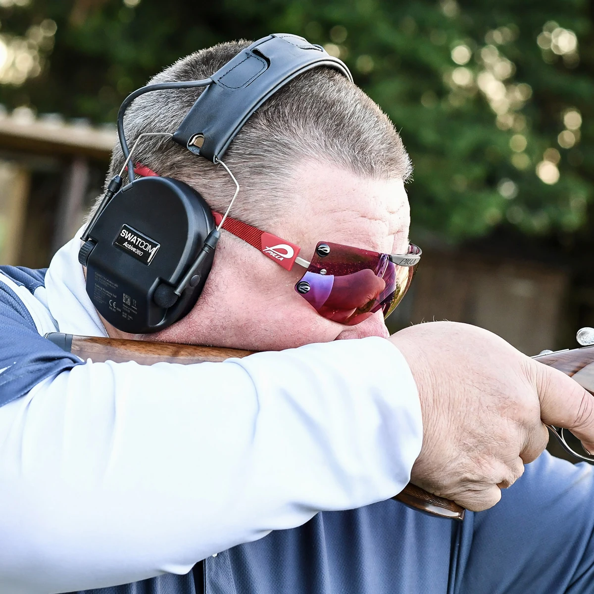 George Digweed wearing SWATCOM Active360 shooting ear defenders